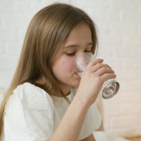 Child drinking from a glass