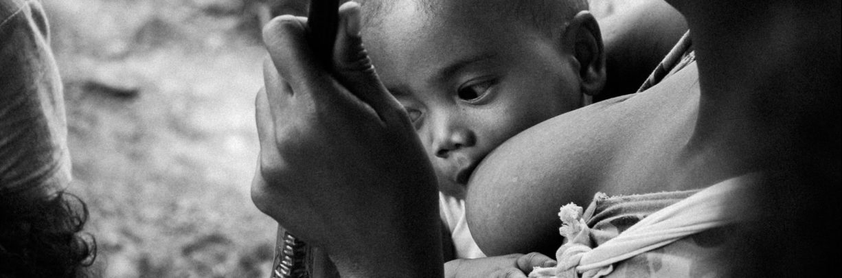 Black and white child breastfeeding