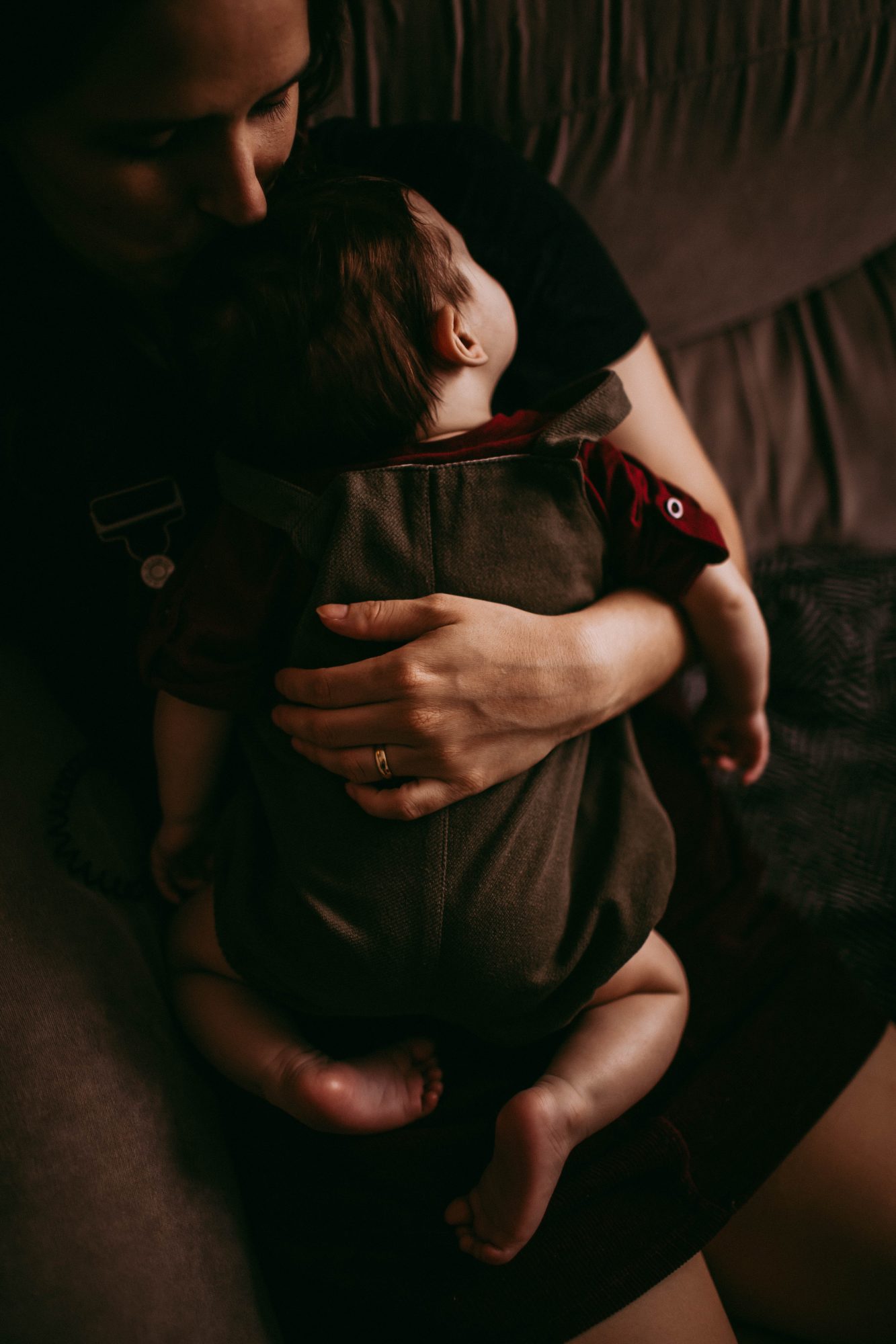 Shot of sleeping baby in an adult's arms
