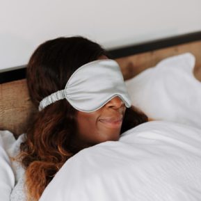 woman in bed with eye mask on