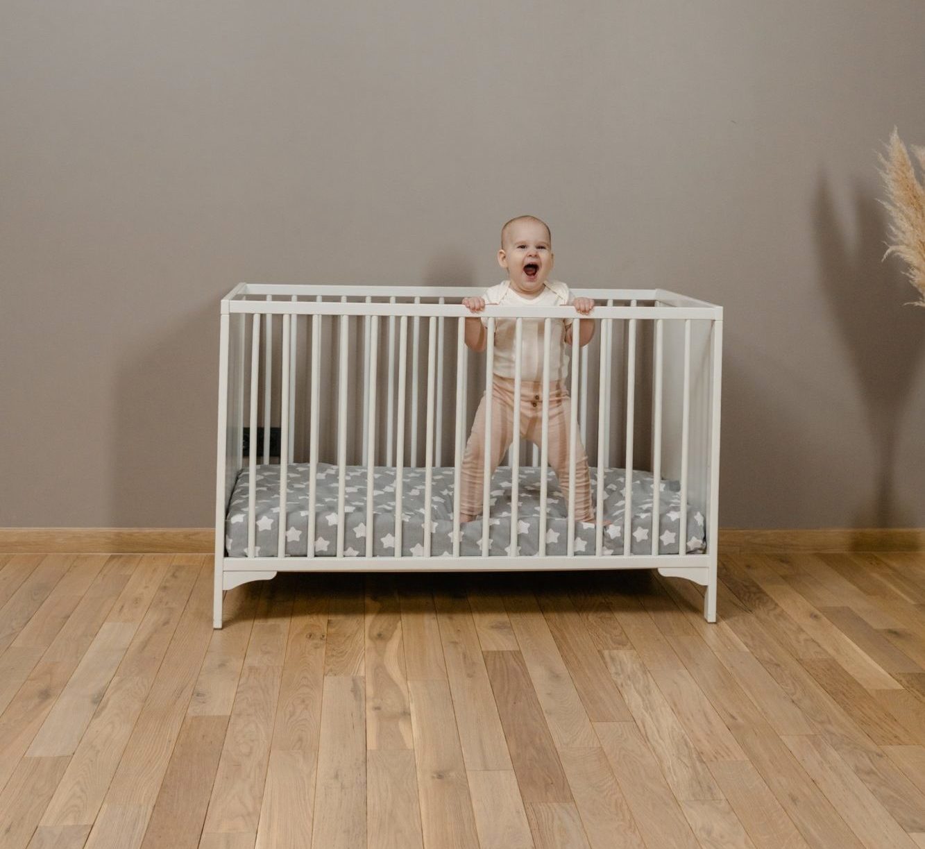 child standing in cot