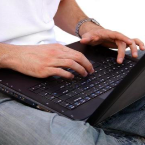Man with laptop on lap