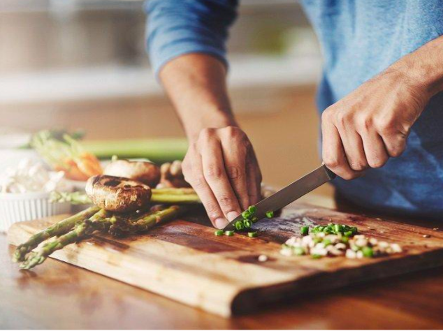 Person chopping food on chopping board