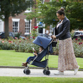 Woman pushing child in stroller