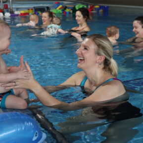 becky Adlington in water with baby